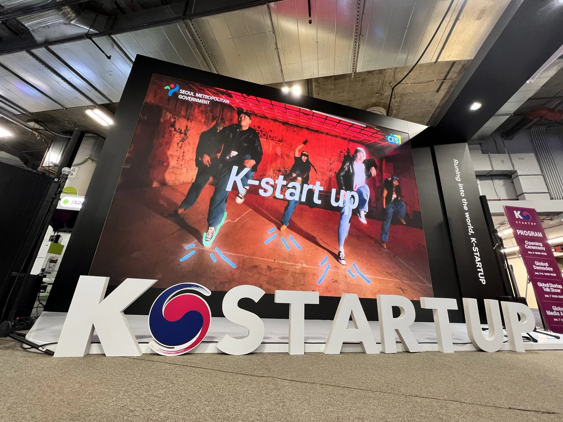 K-STARTUP branded LED wall and dimensional entrance sign at an exhibition program