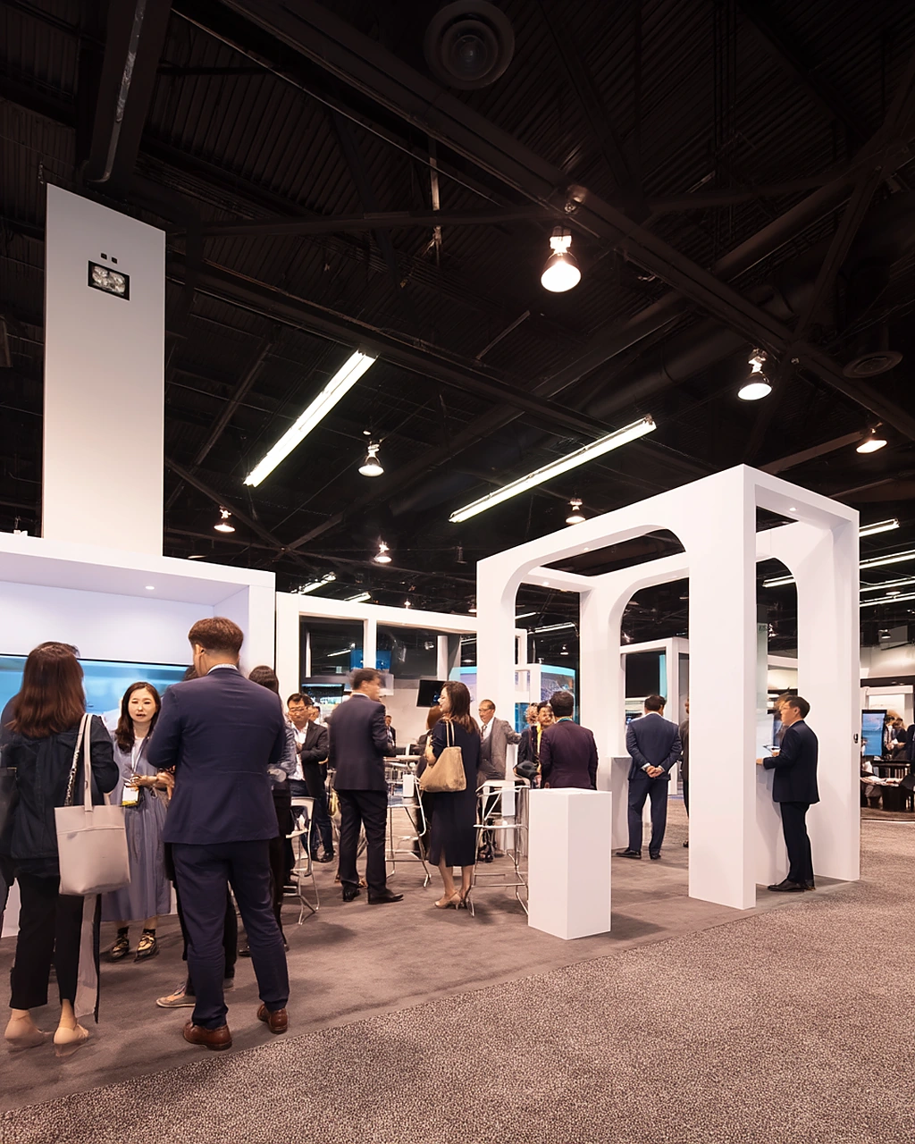 Trade pavilion booths and business networking inside an Anaheim convention environment